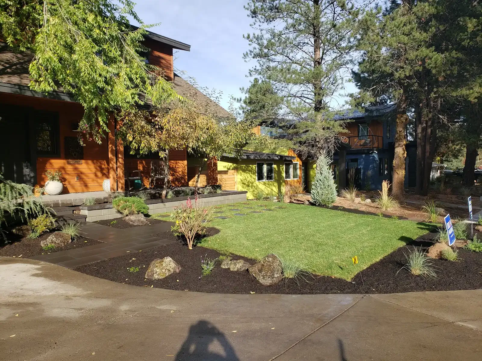 New lawn, pavers, and rock features