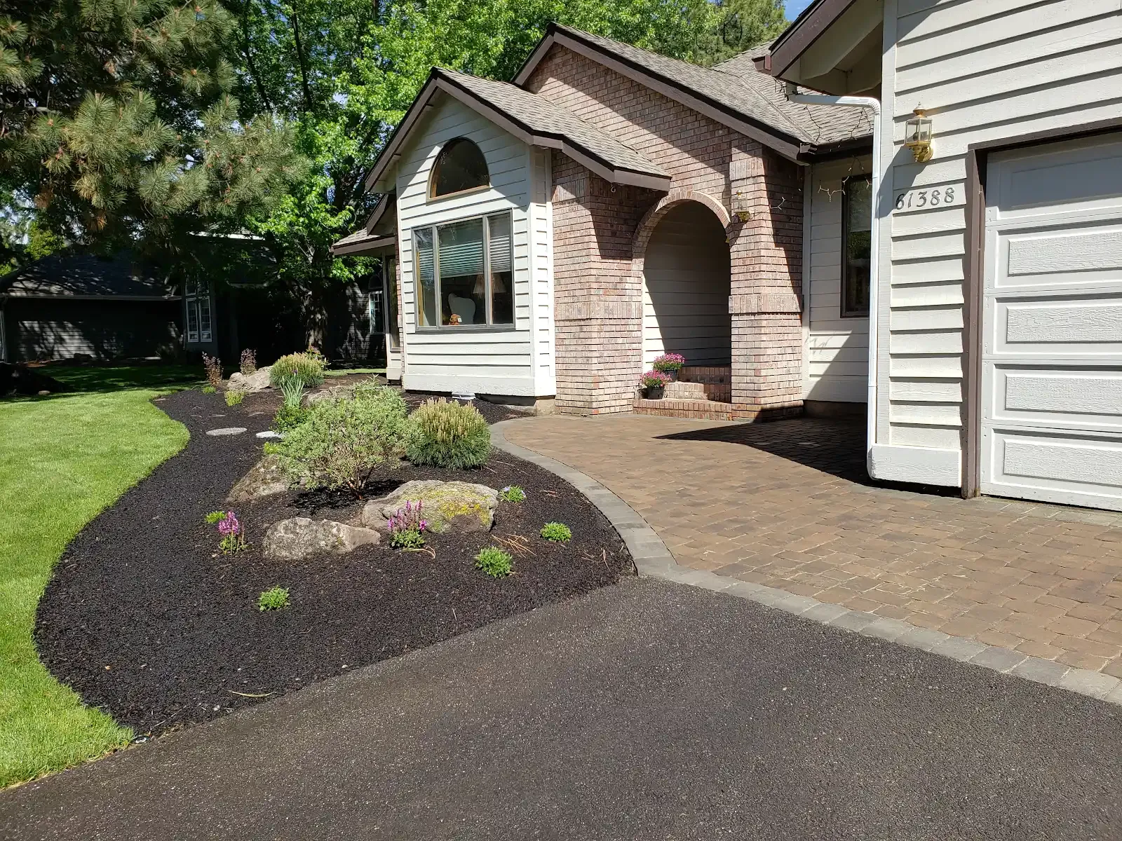 Paver entry with brick accents and planting beds