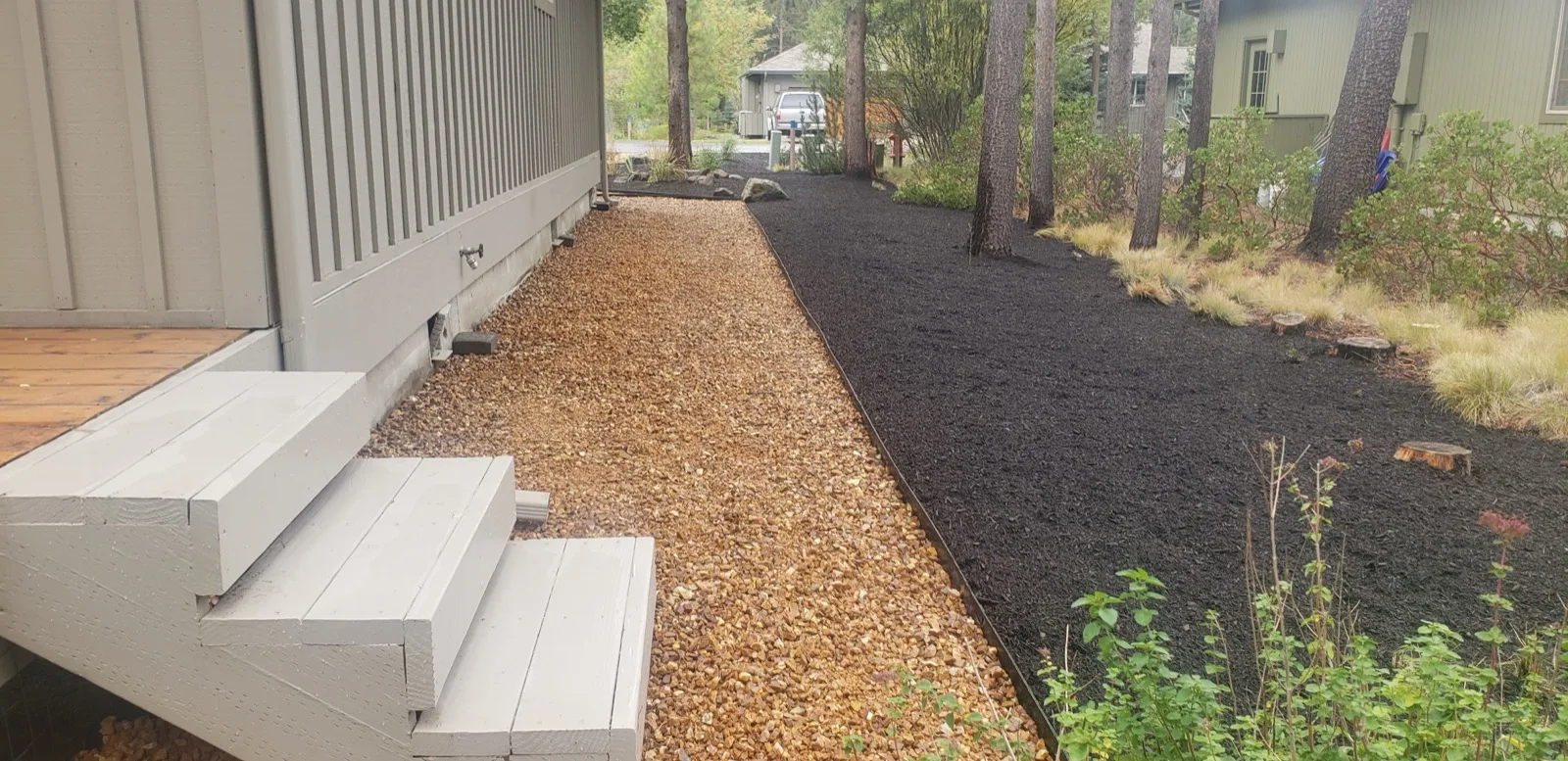 Clean gravel side path with mulch border